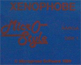 Top of cartridge artwork for Xenophobe on the Commodore Amiga.
