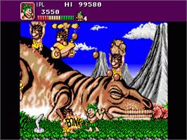 In game image of Joe & Mac: Caveman Ninja on the Commodore Amiga.
