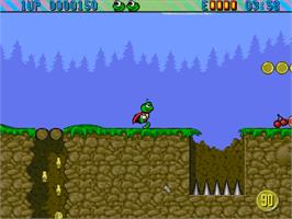 In game image of Super Frog on the Commodore Amiga CD32.
