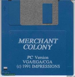 Artwork on the Disc for Merchant Colony on the Microsoft DOS.