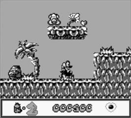 In game image of Chuck Rock on the Nintendo Game Boy.