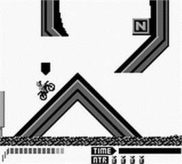 In game image of Motocross Maniacs on the Nintendo Game Boy.