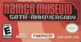 Top of cartridge artwork for Namco Museum 50th Anniversary on the Nintendo Game Boy Advance.
