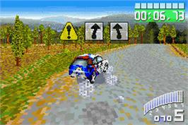 In game image of Colin McRae Rally 2.0 on the Nintendo Game Boy Advance.