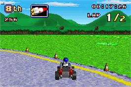 In game image of LEGO Racers 2 on the Nintendo Game Boy Advance.