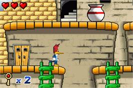 In game image of Woody Woodpecker in Crazy Castle 5 on the Nintendo Game Boy Advance.