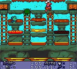 In game image of Flintstones: Burgertime in Bedrock on the Nintendo Game Boy Color.