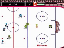 In game image of Ice Hockey on the Nintendo NES.
