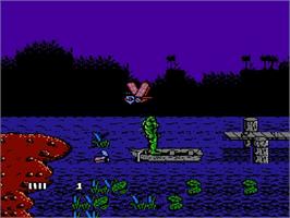 In game image of Swamp Thing on the Nintendo NES.