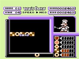 In game image of Yoshi's Cookie on the Nintendo NES.