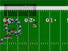 In game image of NCAA Football on the Nintendo SNES.