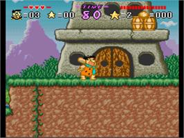 In game image of The Flintstones: The Treasure of Sierra Madrock on the Nintendo SNES.