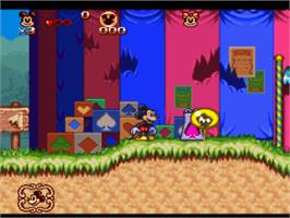 In game image of The Great Circus Mystery starring Mickey and Minnie Mouse on the Nintendo SNES.