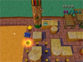 In game image of Ms. Pac-Man Maze Madness on the Sega Dreamcast.