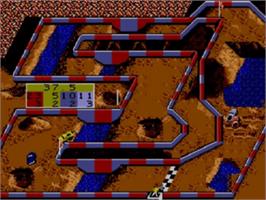 In game image of Ironman Ivan Stewart's Super Off-Road on the Sega Game Gear.