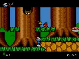 In game image of Smurfs on the Sega Game Gear.