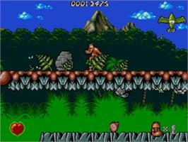 In game image of Chuck Rock on the Sega Genesis.