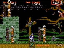 In game image of Ghouls'n Ghosts on the Sega Genesis.