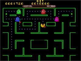 In game image of Ms. Pac-Man on the Sega Master System.