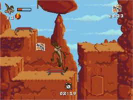 In game image of Desert Demolition Starring Road Runner and  Wile E. Coyote on the Sega Nomad.