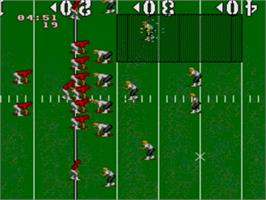 In game image of NCAA Football on the Sega Nomad.