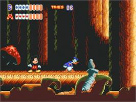 In game image of World of Illusion starring Mickey Mouse and Donald Duck on the Sega Nomad.