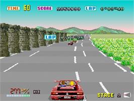 In game image of Out Run on the Sega Saturn.