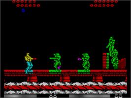 In game image of Forgotten Worlds on the Sinclair ZX Spectrum.