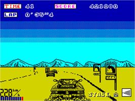 In game image of OutRun on the Sinclair ZX Spectrum.