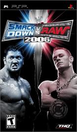 Box cover for WWE Smackdown vs. Raw 2006 on the Sony PSP.