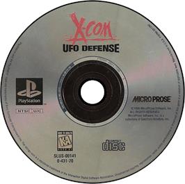 Artwork on the Disc for X-COM: UFO Defense on the Sony Playstation.