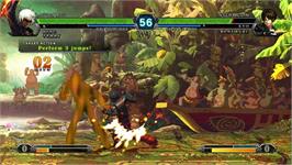 In game image of King of Fighters XIII, The on the Taito Type X2.