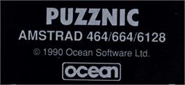 Top of cartridge artwork for Puzznic on the Amstrad CPC.