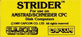 Top of cartridge artwork for Strider on the Amstrad CPC.