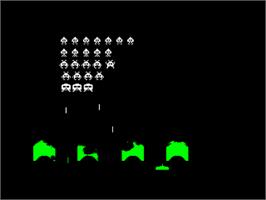 In game image of Space Invaders (Auntie John) on the Amstrad CPC.