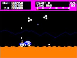 In game image of Moon Patrol on the Apple II.