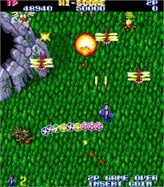 In game image of Gemini Wing on the Arcade.