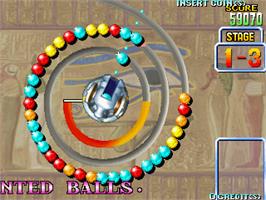 In game image of Puzz Loop on the Arcade.