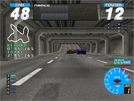 In game image of Rave Racer on the Arcade.