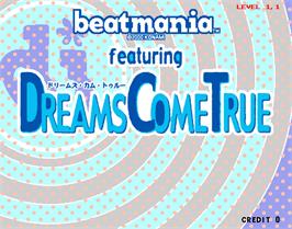 Title screen of beatmania featuring Dreams Come True on the Arcade.