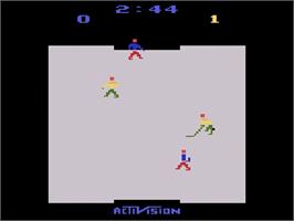 In game image of Ice Hockey on the Atari 2600.