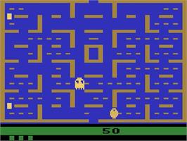 In game image of Pac-man on the Atari 2600.