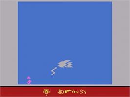 In game image of Raiders of the Lost Ark on the Atari 2600.