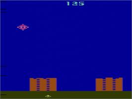 In game image of River Raid on the Atari 2600.