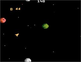 In game image of Asteroids on the Atari 7800.