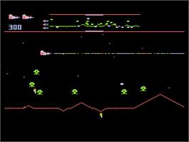 In game image of Defender on the Atari 8-bit.