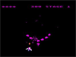 In game image of Gyruss on the Atari 8-bit.