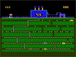 In game image of Oil's Well on the Atari 8-bit.