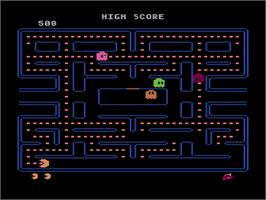 In game image of Pac-man on the Atari 8-bit.
