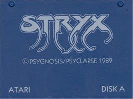 Top of cartridge artwork for Stryx on the Atari ST.